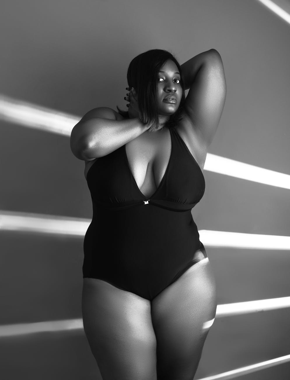woman in black one piece swimsuit