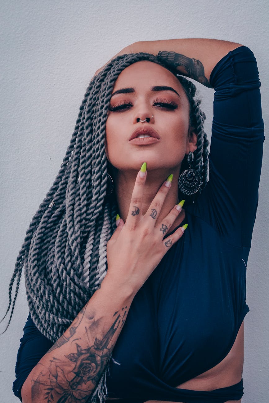 woman wearing long sleeved crop top leaning on wall